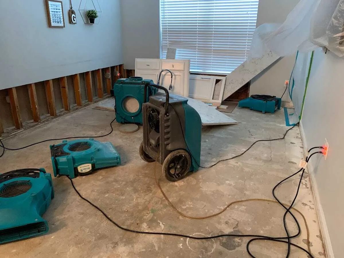 Dehumidifier in flood-cut room for Water Damage Restoration in Melissa